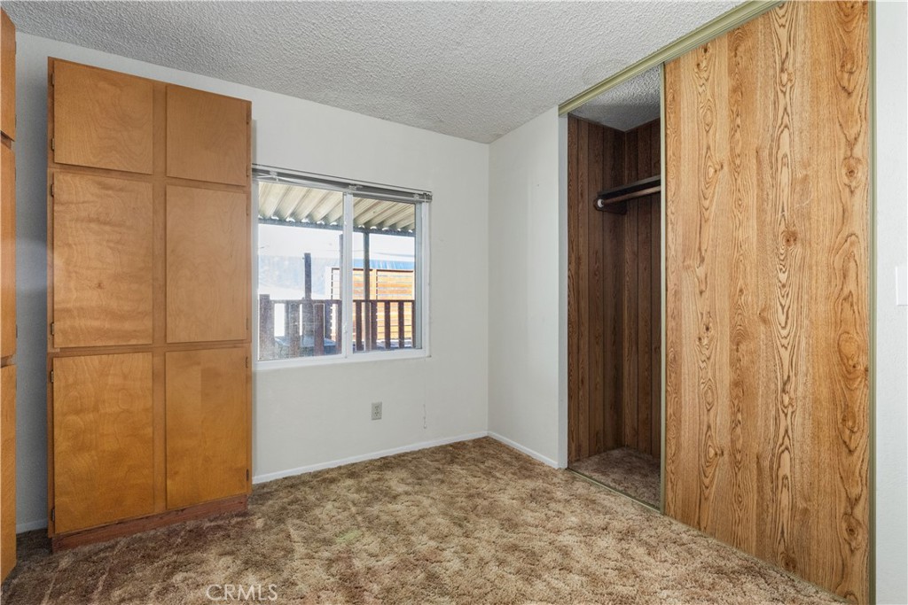 1220 Bennett Way, Unit 1 Templeton, CA 93465 - Photo 22 of 37 a view of an empty room with window and stairs