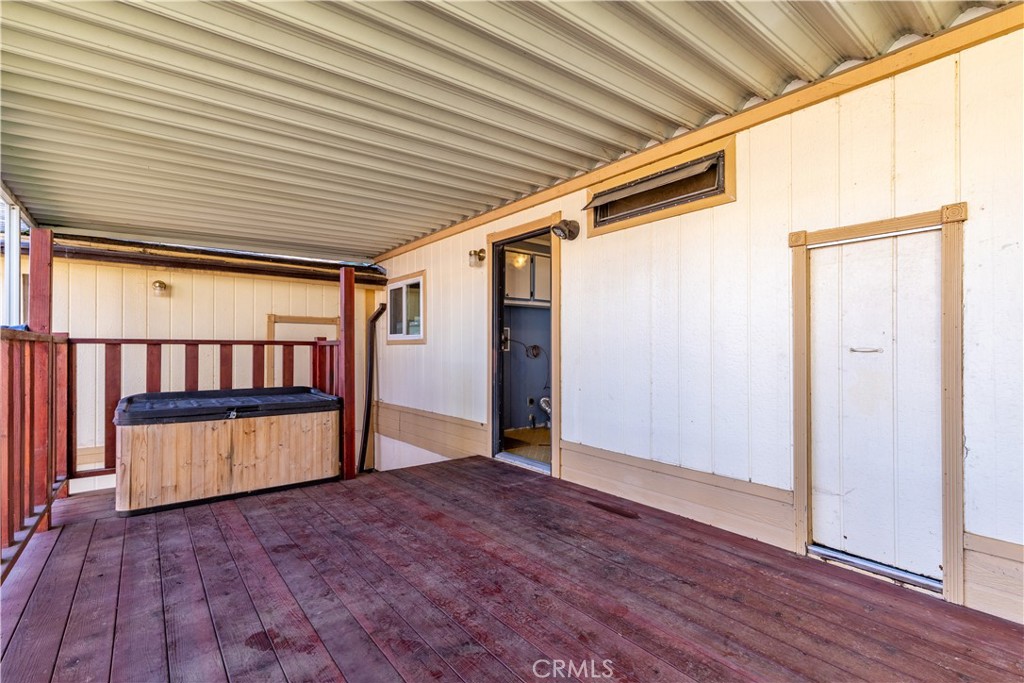 1220 Bennett Way, Unit 1 Templeton, CA 93465 - Photo 32 of 37 an empty room with wooden floor and windows