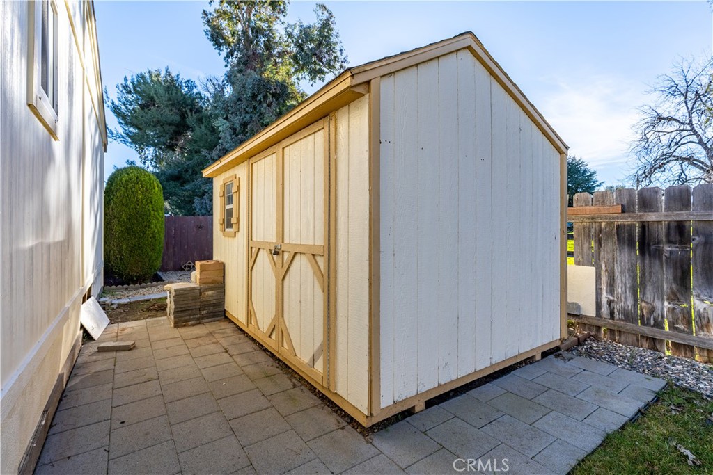 1220 Bennett Way, Unit 1 Templeton, CA 93465 - Photo 35 of 37 a backyard of a house with table and chairs
