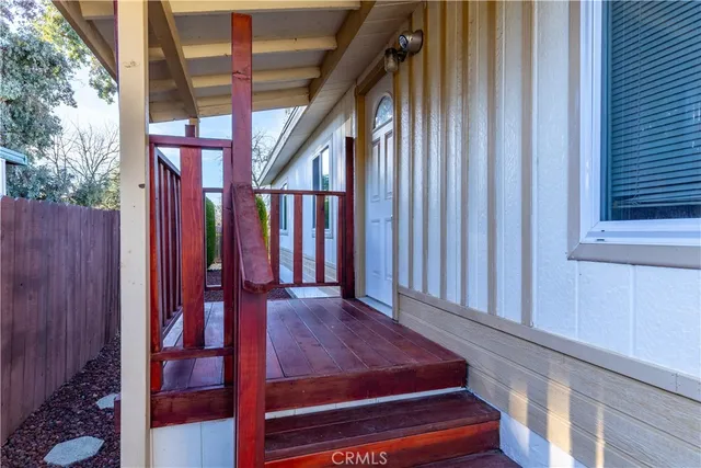 a view of staircase with railing and a potted plant