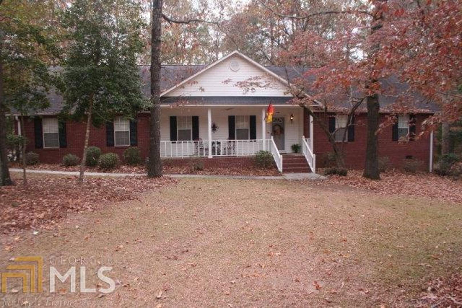 188 Woodland Heights Road Dublin, GA 31021 - Photo 1 of 1 a front view of a house with garden