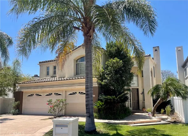 a view of a water fountain in front of a house