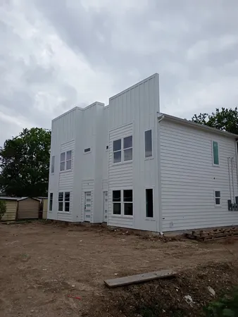 a house view with a backyard space