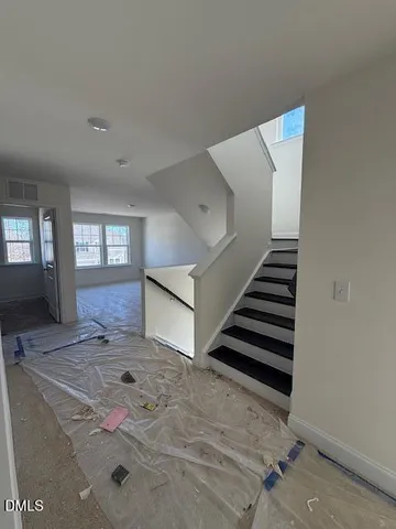 a view of a hallway with staircase