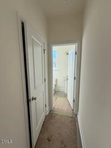 a view of a bathroom from a hallway