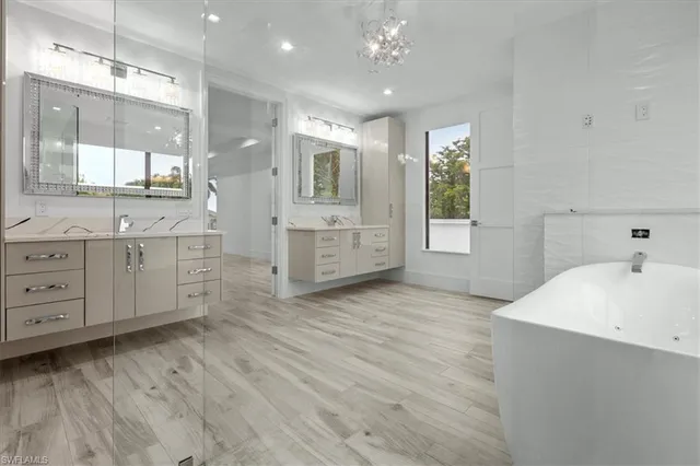 a large room with a lot of counter space and wooden floor