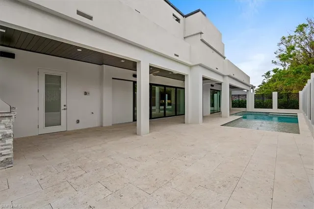a view of an entrance of house with green space