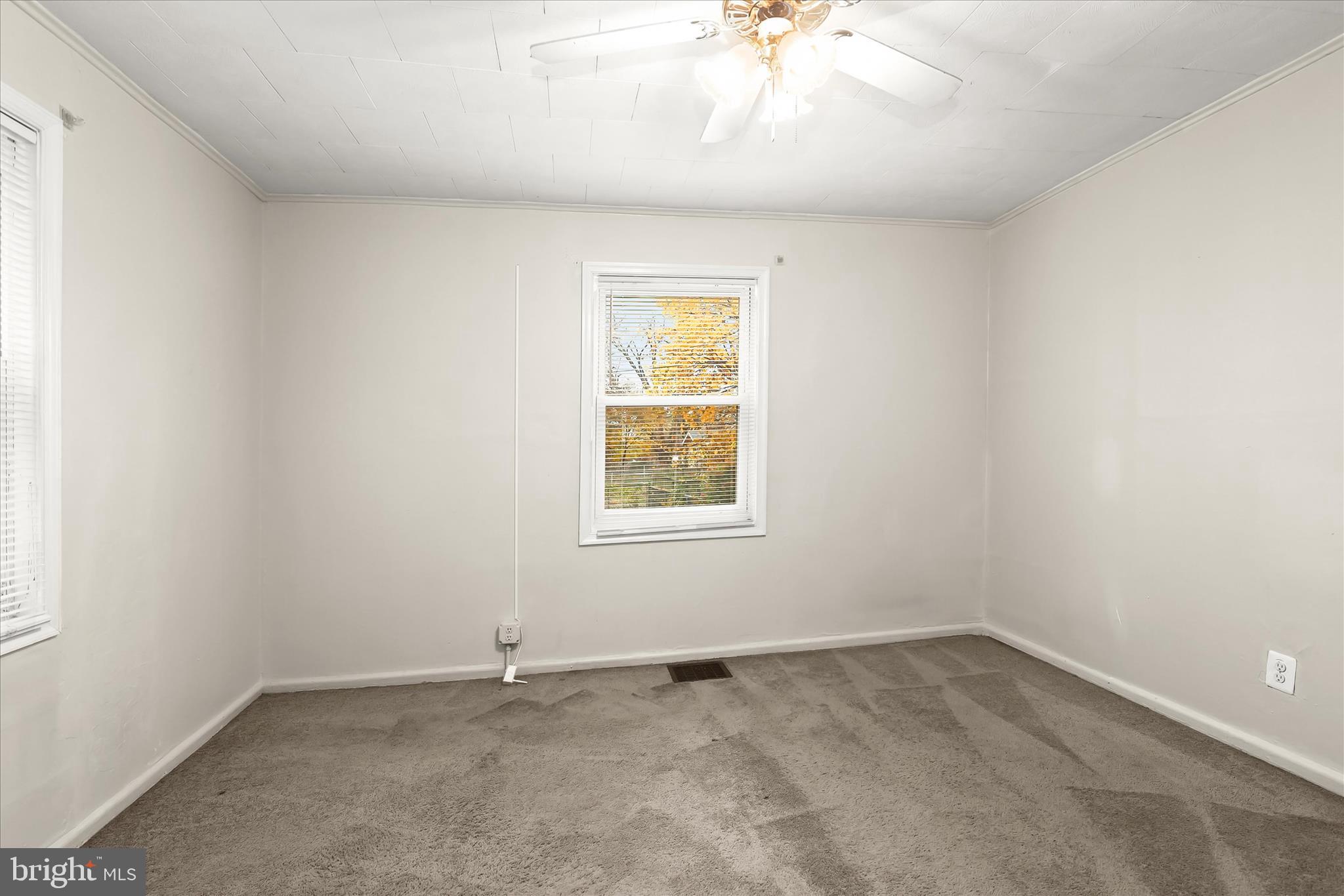 3511 6th Street Baltimore, MD 21225 - Photo 12 of 31 an empty room with a window