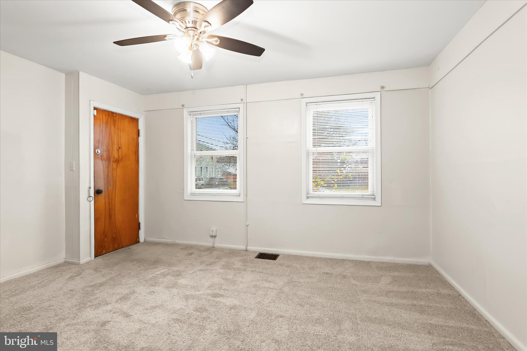 3511 6th Street Baltimore, MD 21225 - Photo 6 of 31 a view of an empty room with a window