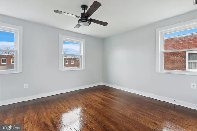 an empty room with white walls and tiles