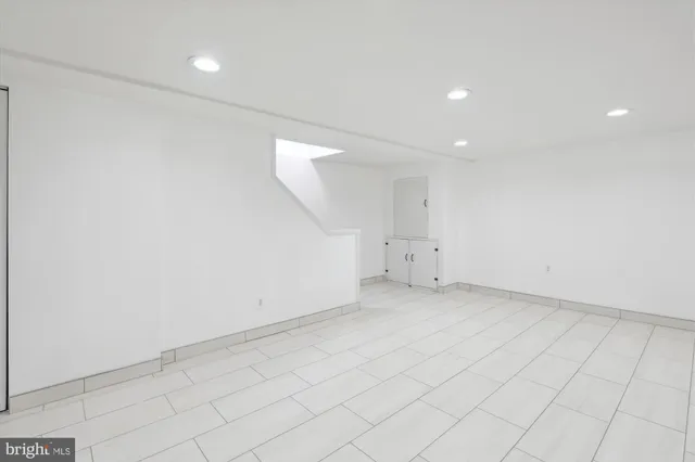 a bathroom with a sink a shower and a mirror