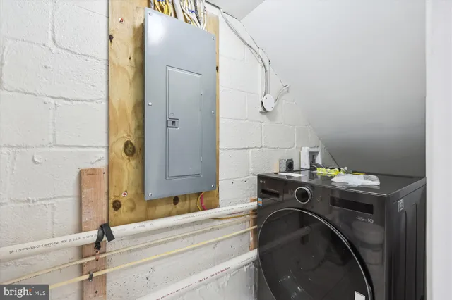 a front view of a building with parking space