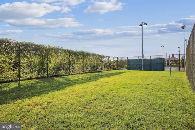 a group of people sitting in front of a building