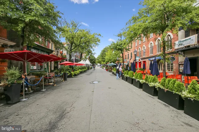 a view of a patio with dining table and chairs