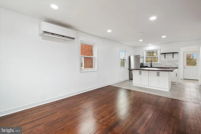 a view of kitchen with wooden floor and window