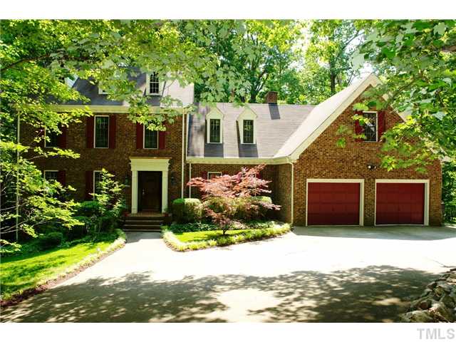 5001 Trail Ridge Drive Raleigh, NC 27613 - Photo 1 of 25 a front view of a house with a yard and garage