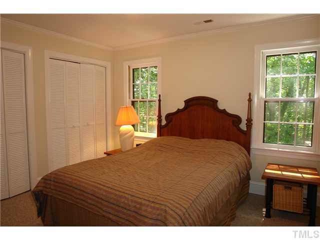 5001 Trail Ridge Drive Raleigh, NC 27613 - Photo 12 of 25 a bedroom with a bed and a window