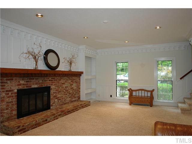 5001 Trail Ridge Drive Raleigh, NC 27613 - Photo 8 of 25 a living room with furniture and a fireplace
