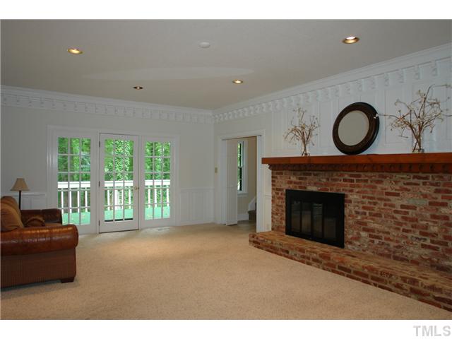 5001 Trail Ridge Drive Raleigh, NC 27613 - Photo 9 of 25 a living room with furniture and a fireplace