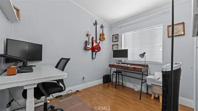 a bedroom with a workspace