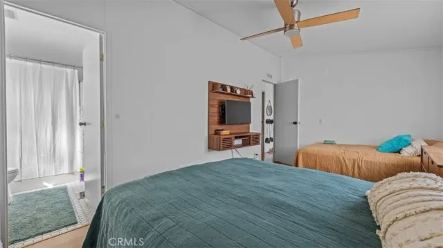 a bedroom with bed and window