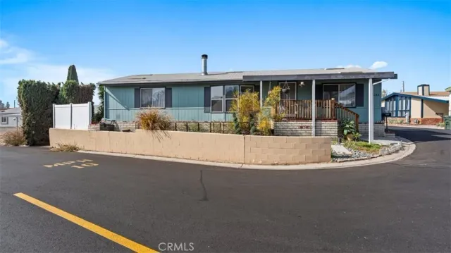 a view of a house with swimming pool and sitting area