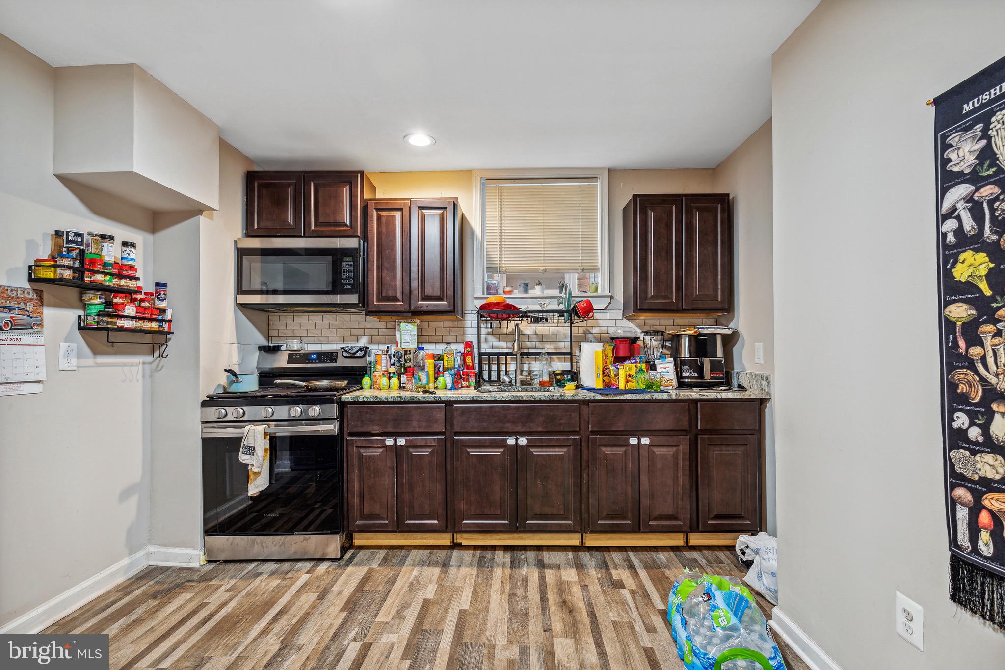 4606 York Road Baltimore, MD 21212 - Photo 18 of 33 a kitchen with stainless steel appliances granite countertop a refrigerator and a stove top oven