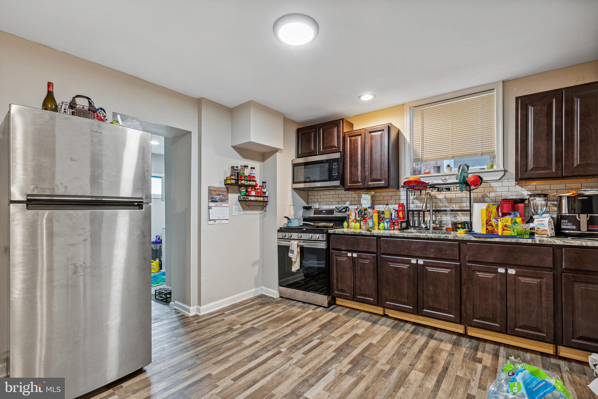 4606 York Road Baltimore, MD 21212 - Photo 19 of 33 a kitchen with stainless steel appliances granite countertop a refrigerator and a stove top oven