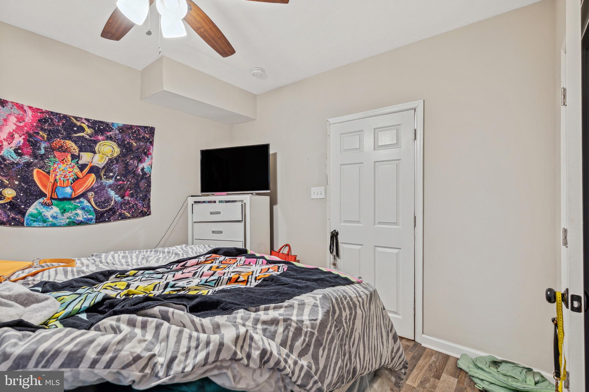 4606 York Road Baltimore, MD 21212 - Photo 22 of 33 a bedroom with a bed and a flat screen tv