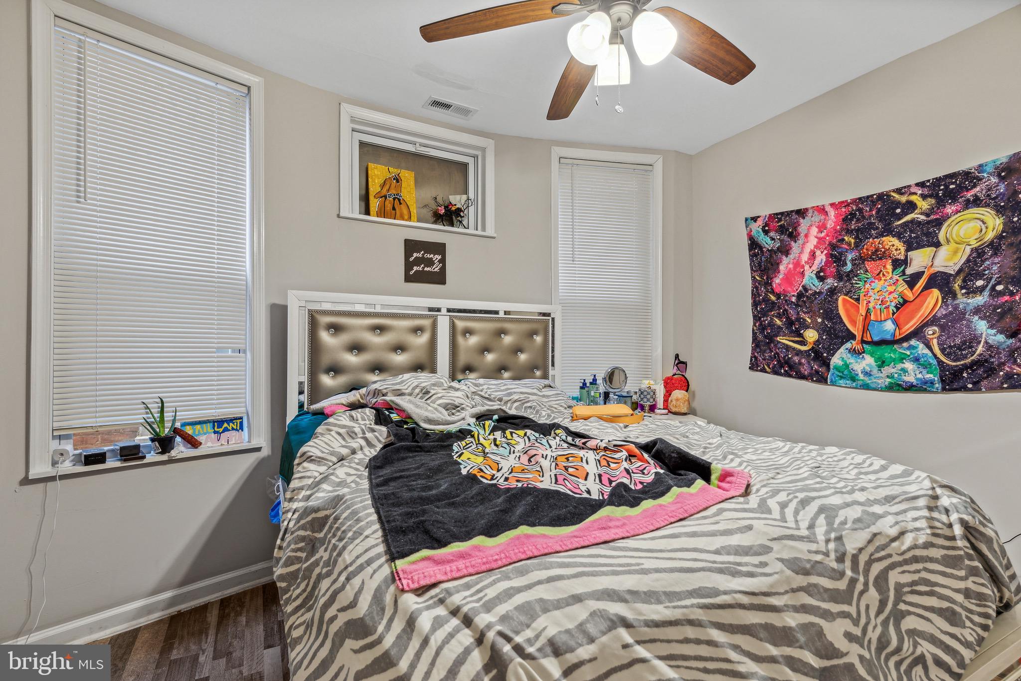 4606 York Road Baltimore, MD 21212 - Photo 23 of 33 a bedroom with a bed and a painting on the wall