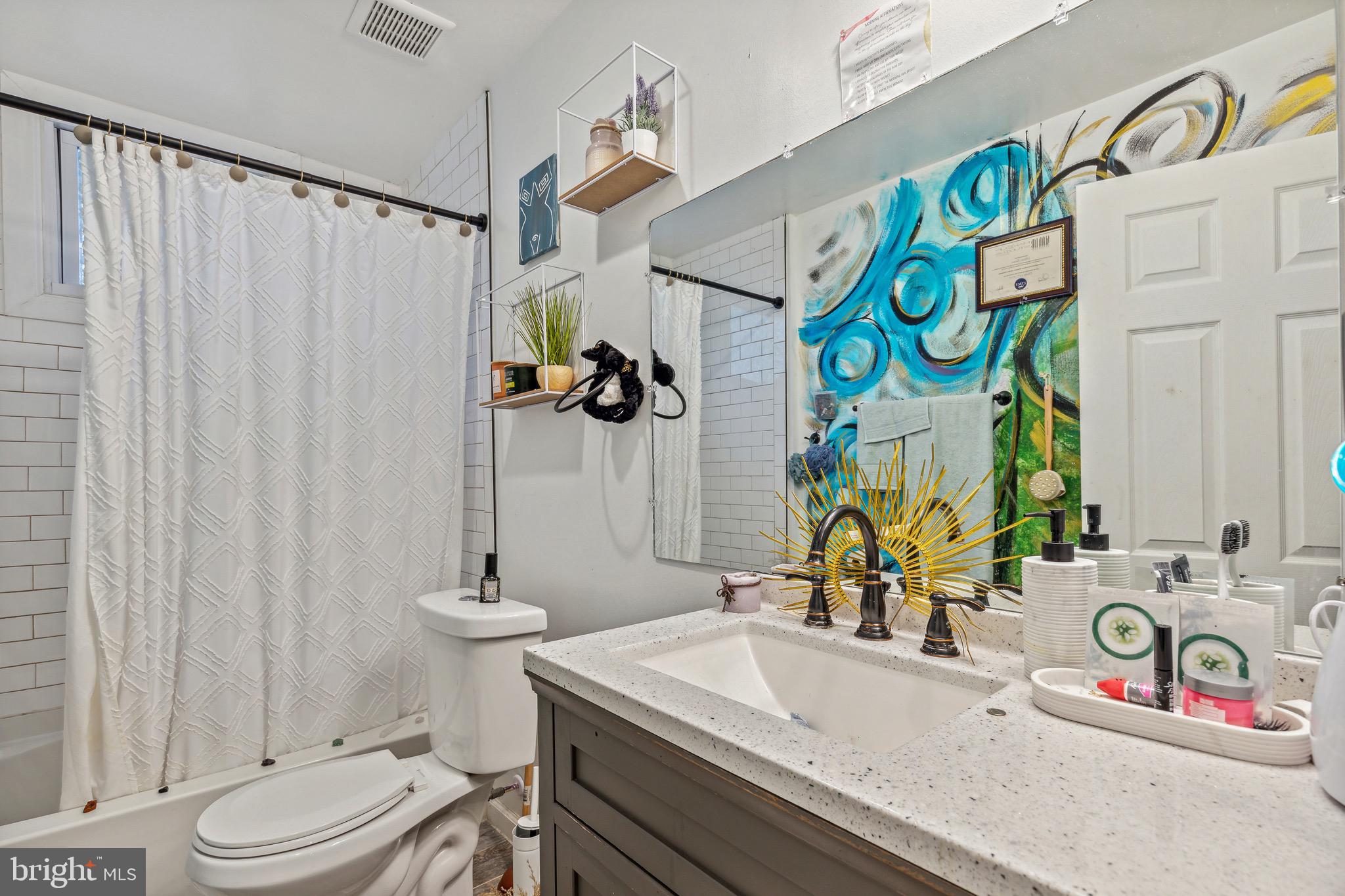 4606 York Road Baltimore, MD 21212 - Photo 25 of 33 a bathroom with a sink a toilet and shower