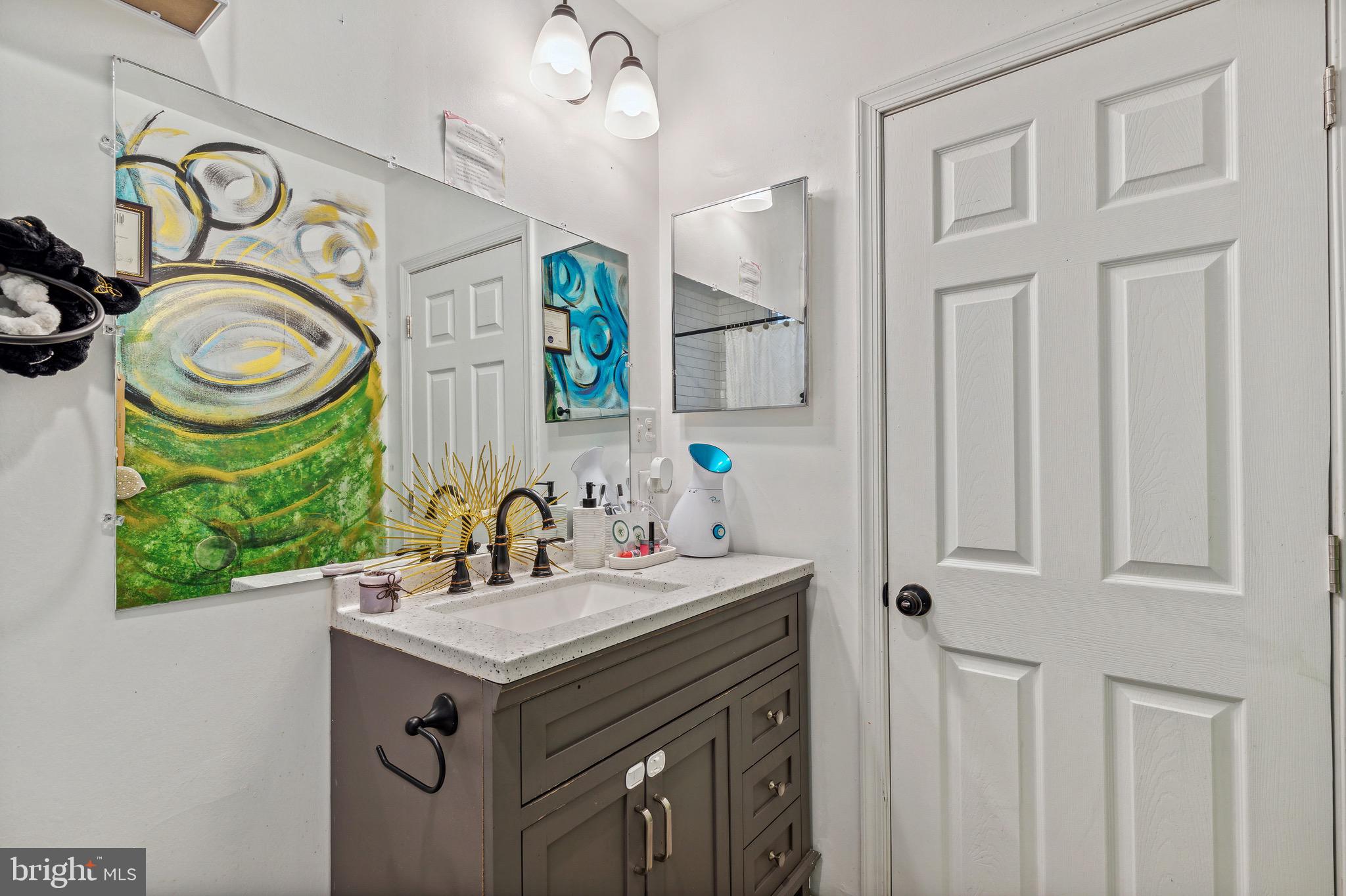 4606 York Road Baltimore, MD 21212 - Photo 26 of 33 a bathroom with a sink a toilet and a mirror