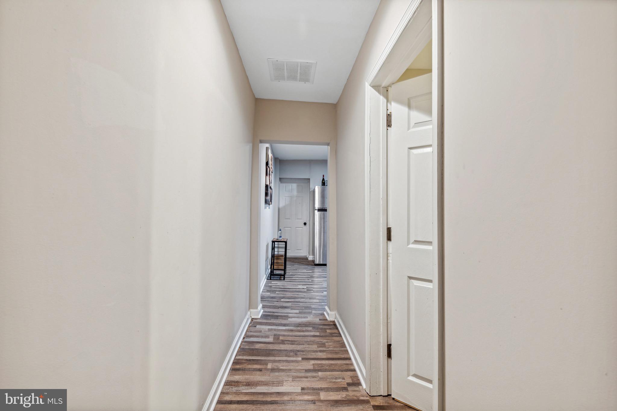 4606 York Road Baltimore, MD 21212 - Photo 28 of 33 a view of a hallway with wooden floor and staircase