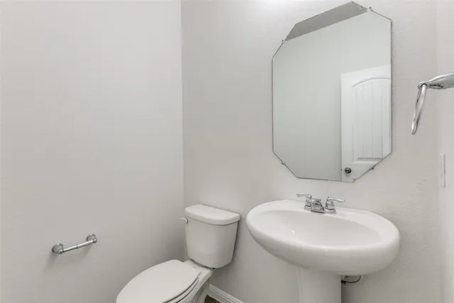 a view of a backyard with a garden and entertaining space