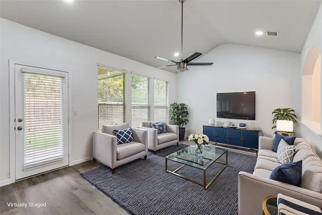 a living room with furniture or couch and a flat screen tv