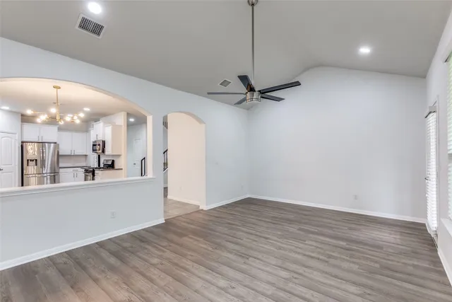 a view of a kitchen with a dishwasher and wooden floor