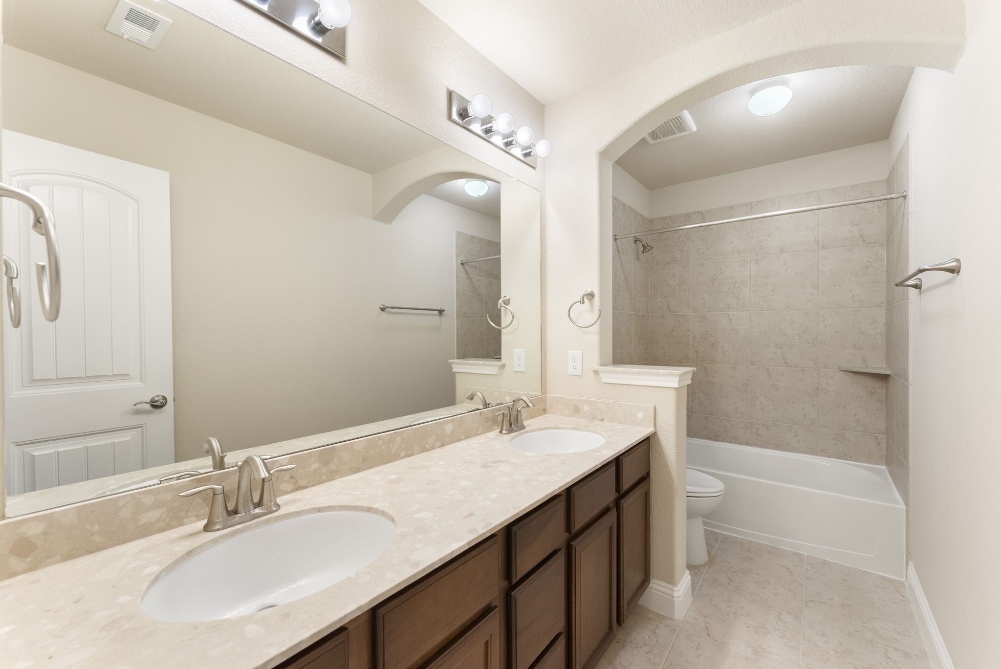 3565 Falcon Way Conroe, TX 77304 - Photo 31 of 50 Secondary bathroom featuring a long vanity and tub/shower combination.