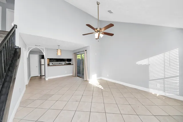 a view of an empty room window and fire place