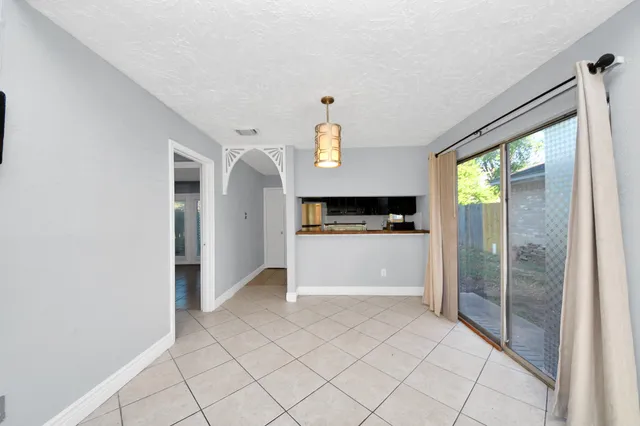 a view of entryway with furniture and wooden floor