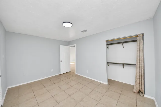 a kitchen with stainless steel appliances granite countertop a stove and a microwave