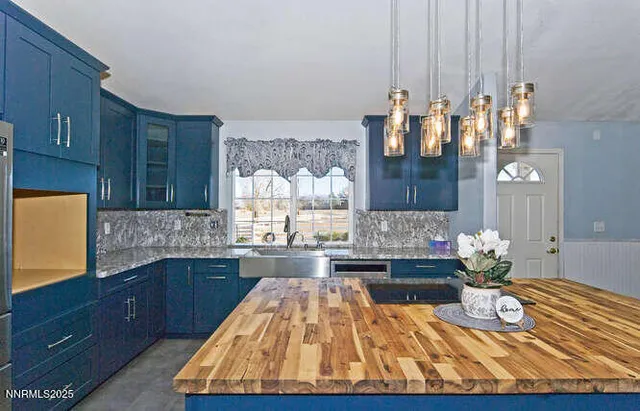 a kitchen with sink and cabinets