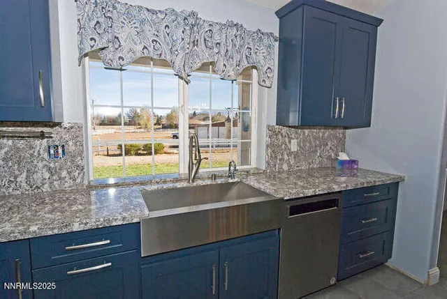 a kitchen with a sink and a wooden cabinets