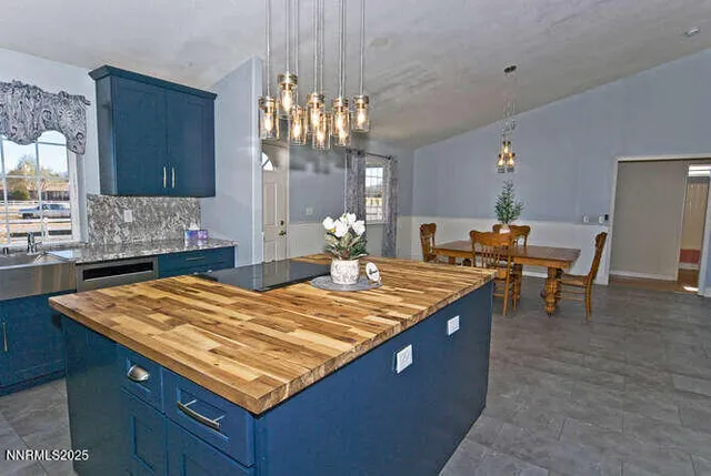 a living room with dining table and chairs