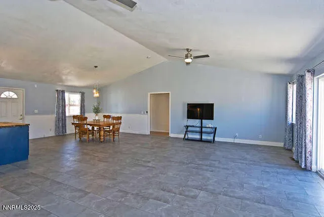a view of livingroom with furniture and window