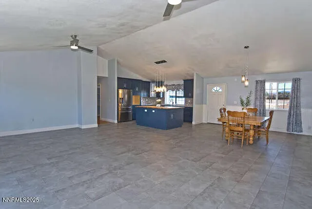 a view of a livingroom with furniture and a table