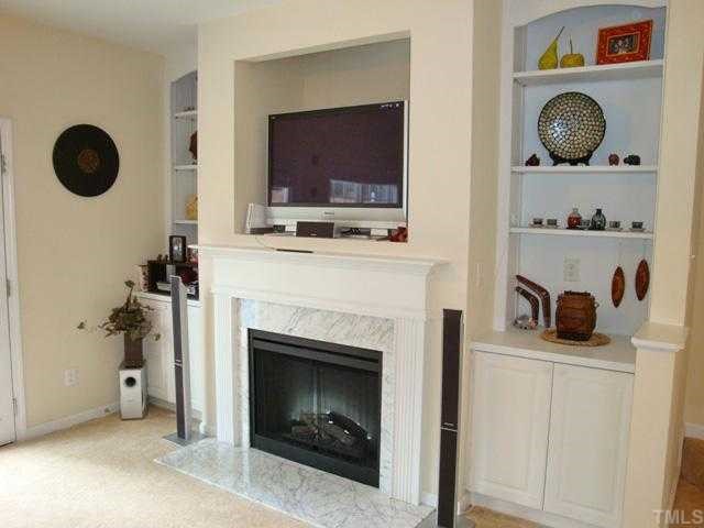 2320 Persimmon Ridge Drive Raleigh, NC 27604 - Photo 7 of 11 a living room with furniture and a fireplace