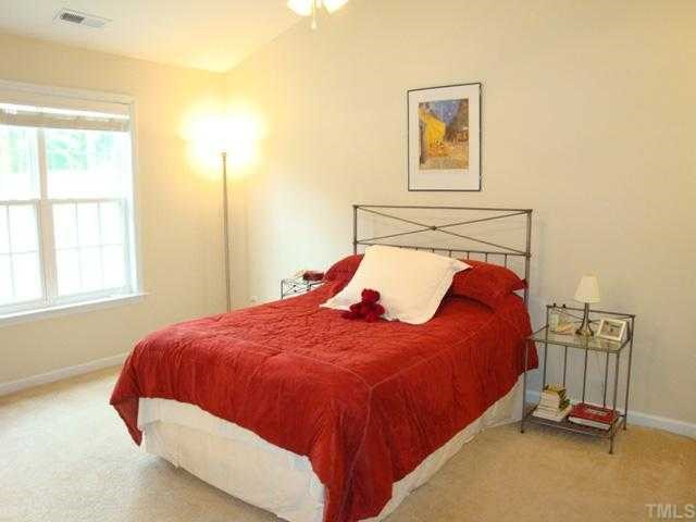 2320 Persimmon Ridge Drive Raleigh, NC 27604 - Photo 8 of 11 a bedroom with a bed and a window