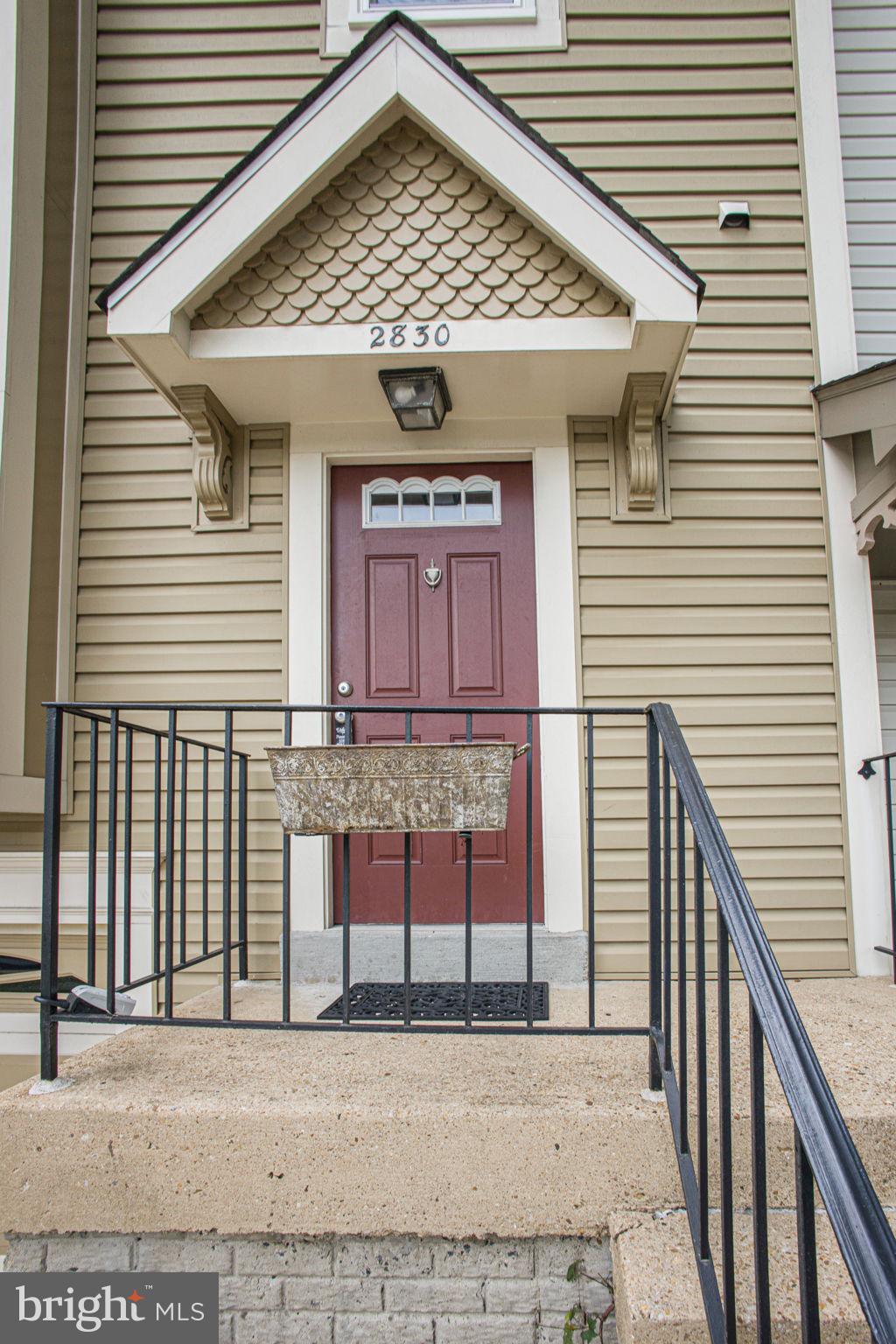 2830 Schoolhouse Circle Silver Spring, MD 20902 - Photo 3 of 58 a view of a house with wooden floor and fence