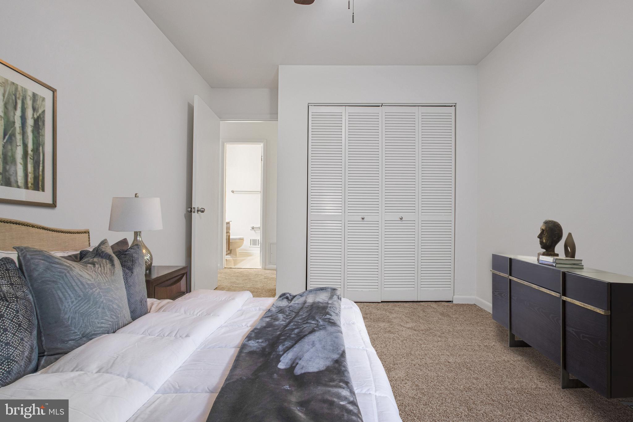2830 Schoolhouse Circle Silver Spring, MD 20902 - Photo 33 of 58 a bedroom with a bed and furniture