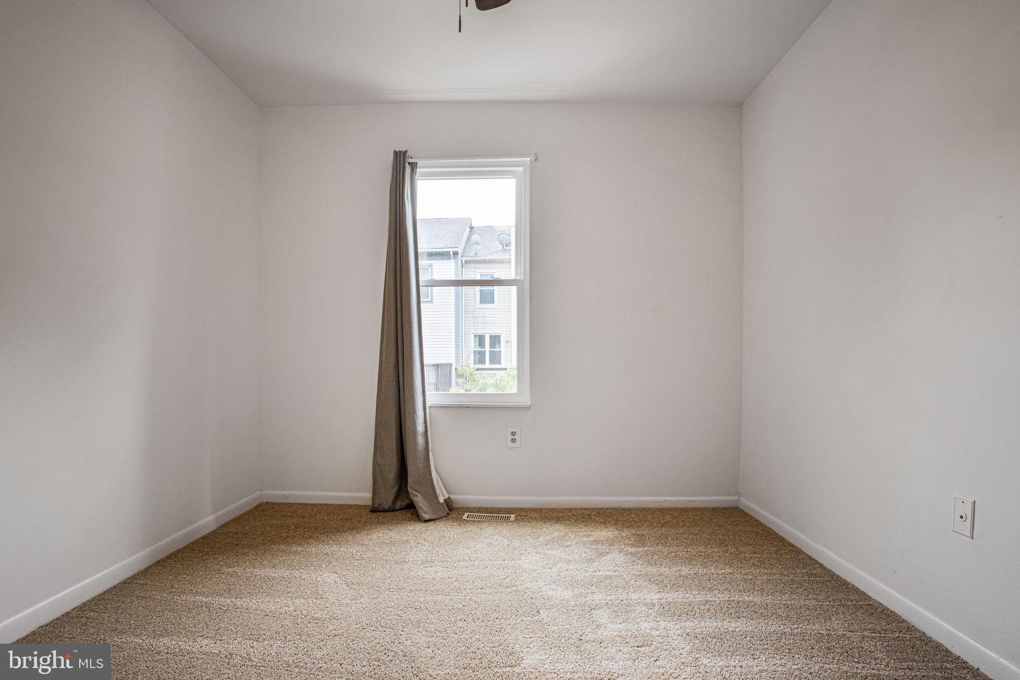 2830 Schoolhouse Circle Silver Spring, MD 20902 - Photo 35 of 58 an empty room with a window